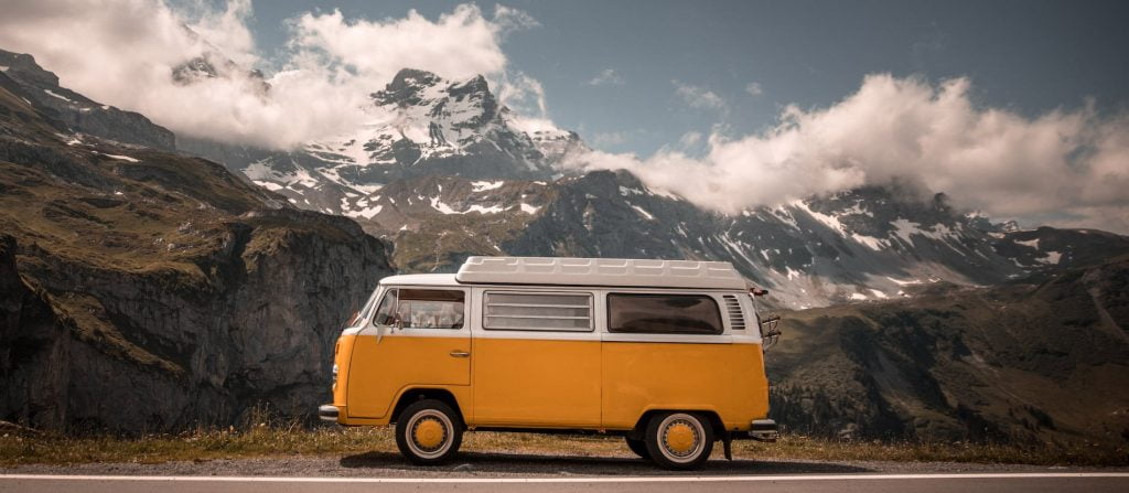 VW camper van parked in front of a dramatic mountain scene on a webpage about a group career and life coaching programme in Edinburgh and online